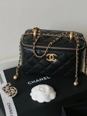 Chanel small black quilted lambskin chain cosmetic bag
